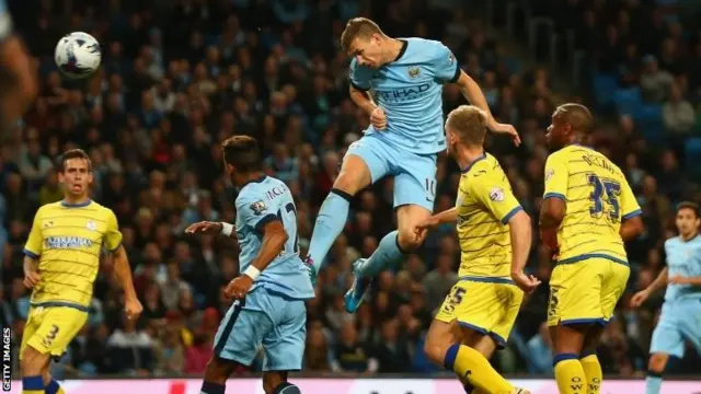 Edin Dzeko scores header