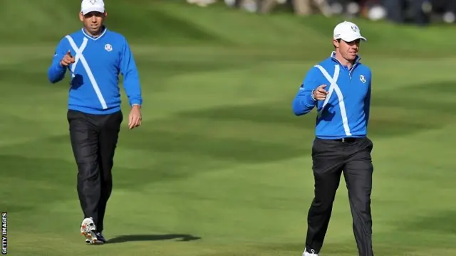 Team Europe's Rory McIlroy of Northern Ireland (R) and Sergio Garcia of Spain