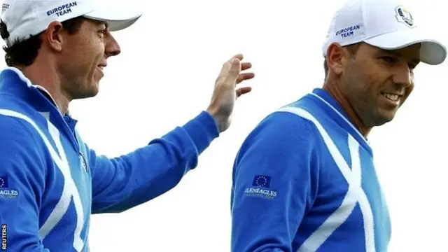 European Ryder Cup player Rory McIlroy (L) congratulates teammate Sergio Garcia