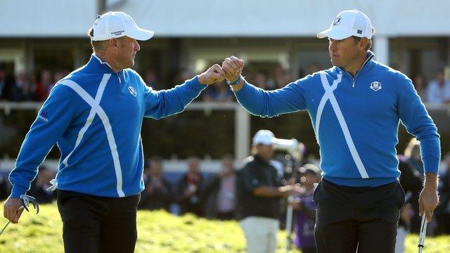 Europe's Jamie Donaldson and Lee Westwood celebrate on the 12th hole