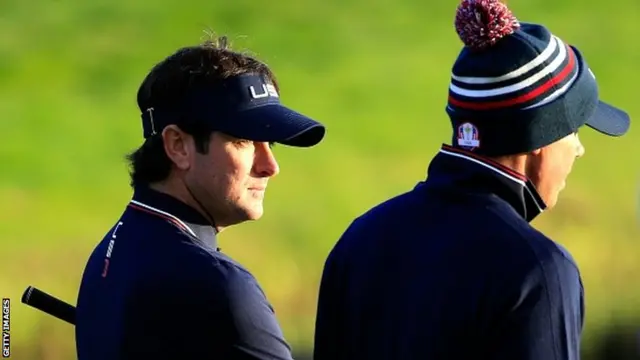 Bubba Watson of the United States talks to Matt Kuchar