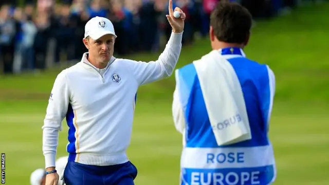 Justin Rose of Europe celebrates his birdie putt on the 10th hole