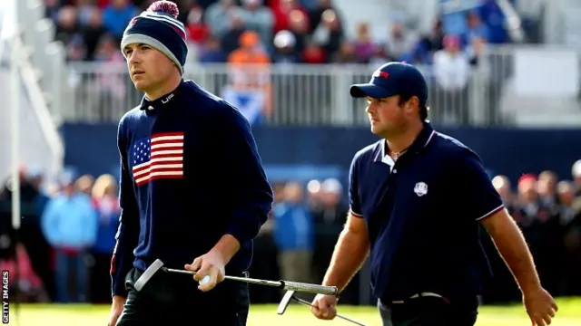 Jordan Spieth (L) and Patrick Reed of the United States