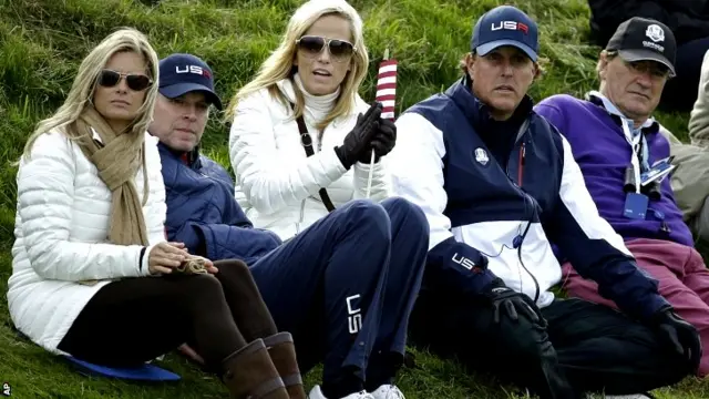 Phil Mickelson of the US, second right, and his wife Amy, centre, vice captain Steve Stricker, second left, and Tabitha Furyk, wife of Jim Furyk,