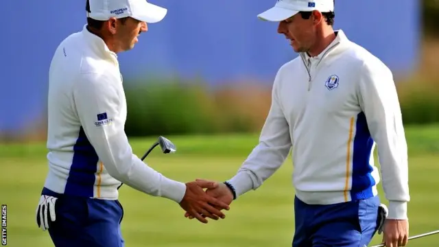 Europe's Rory McIlroy of Northern Ireland (R) and Sergio Garcia of Spain