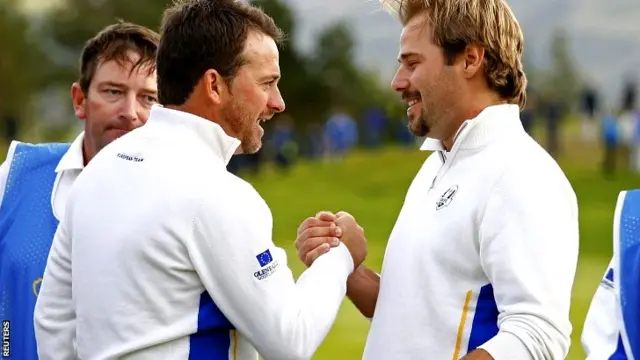 European Ryder Cup players Graeme McDowell (L) and Victor Dubuisson