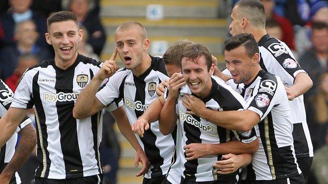 Notts County players celebrate Blair Adams' goal against Chesterfield