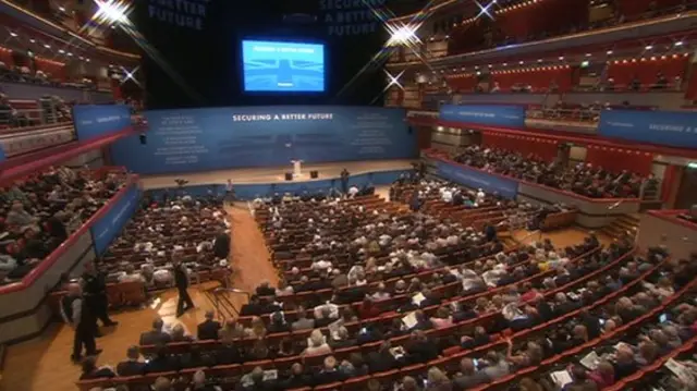 A wide shot of the conference hall