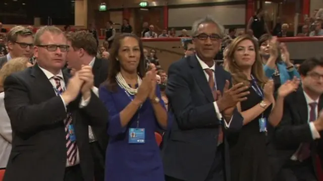 Conservative party members and football boss and Apprentice TV show star Karen Brady rise to applause Patrick McLoughlin's speech