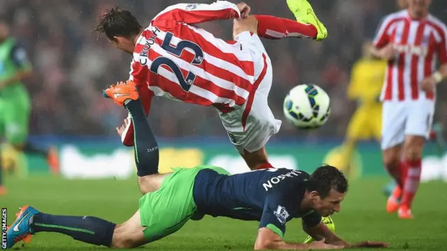 Stoke striker Peter Crouch is upended against Newcastle