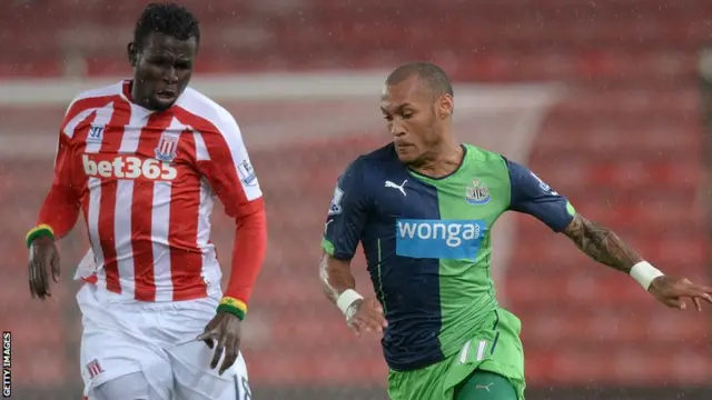 Newcastle United striker Yoan Gouffran outruns Stoke's Mame Biram Diouf