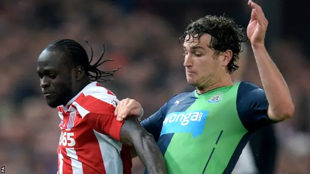 Stoke's Victor Moses holds off Newcastle defender Daryl Janmaat