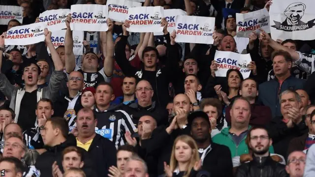 Newcastle United fans hold anti-Pardew protest posters