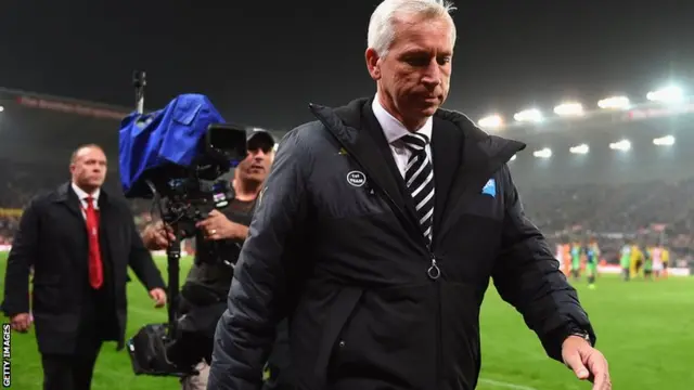 Newcastle United manager Alan Pardew walks off the pitch at full-time against Stoke