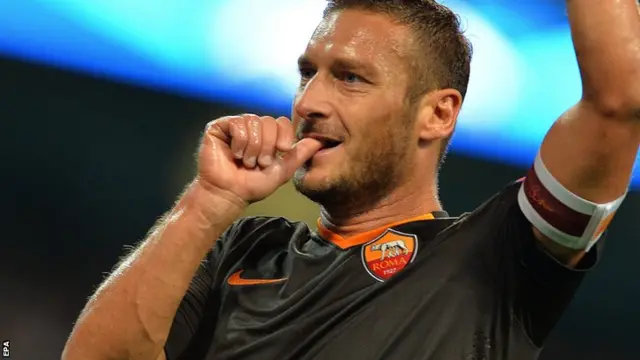 Francesco Totti celebrates his goal for Roma against Manchester City