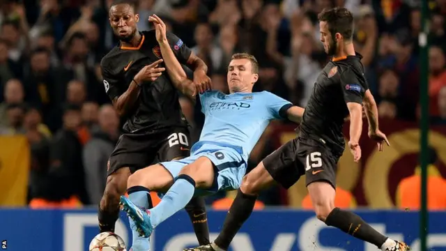 Manchester City striker Edin Dzeko is fouled