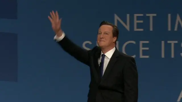 David Cameron entering the stage