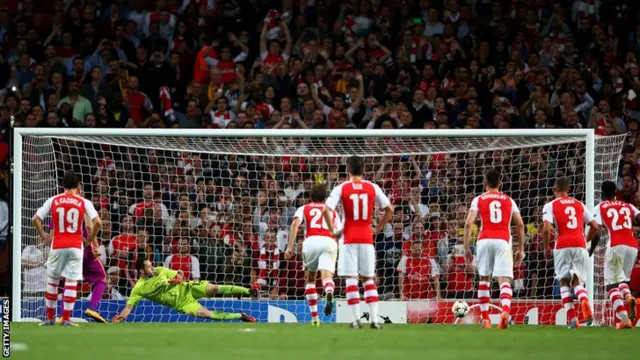 Burak Yilmaz scores from the penalty spot