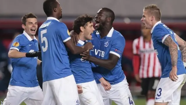 Dinamo Moscow players celebrate with Yuri Zhirkov (centre)