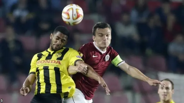 Gregory Wuthrich, left, of Young Boys Bern fights for a header with David Lafata, right, of Sparta Prague during the Europa League