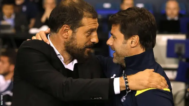 Mauricio Pochettino and Slaven Bilic greet each other