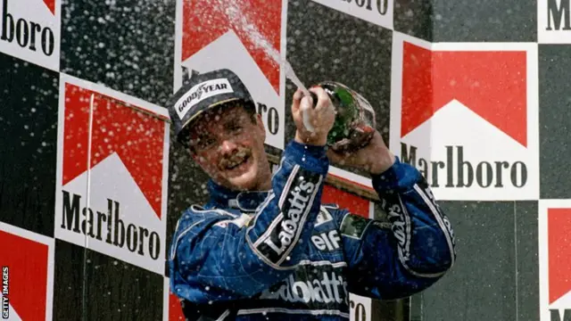 Nigel Mansell celebrates winning the 1992 World Championship