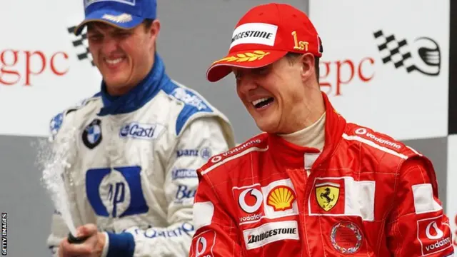 Ralf Schumacher celebrates finishing on the podium in 2004