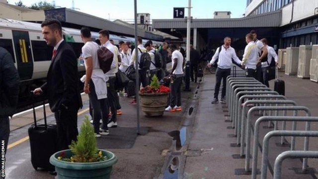 Southampton players wait for train