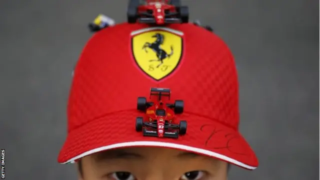 Japanese boy wearing a Ferrari cap