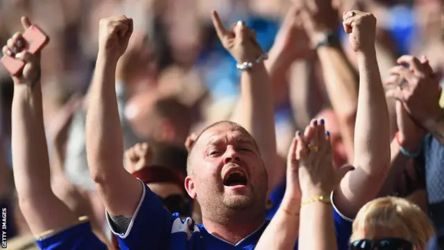 Leicester fans celebrate at the King Power stadium