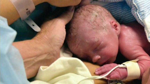 Photo shows the first baby born by womb transplant to Swedish parents