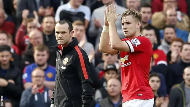 Manchester United's Luke Shaw goes off injured