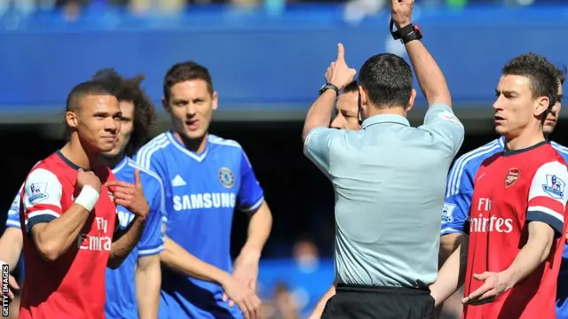 Arsenal's Kieran Gibbs (left) is sent off by mistake by referee Andre Marriner