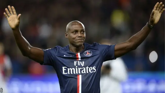 US athletics legend Carl Lewis salutes the crowd ahead of PSG v Monaco