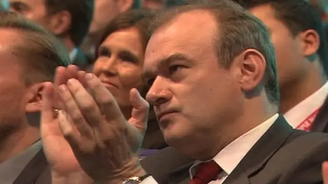 Ed Davey, Energy Secretary, applauds Nick Clegg