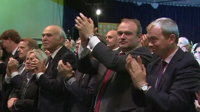 The Lib Dem frontbench team applauding Nick Clegg