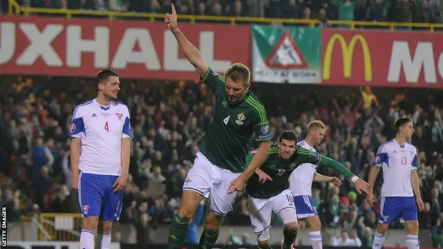 Gareth McAuley celebrates