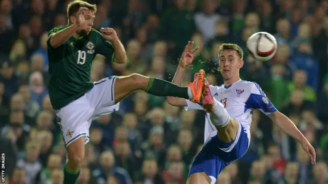 Jamie Ward challenges for the ball