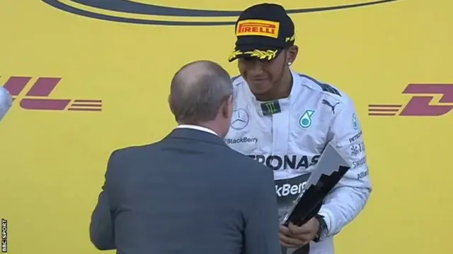 Hamilton gets trophy from Vladimir Putin