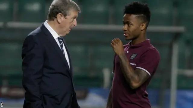 England manager Roy Hodgson in conversation with Raheem Sterling