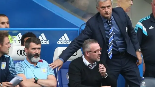 Jose Mourinho (left) attempts to shake hands with Roy Keane