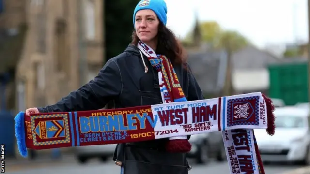 A scarf seller pre-match