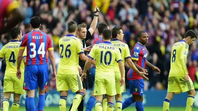 Cesar Azpilicueta is shown a red card