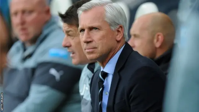 Alan Pardew looks on