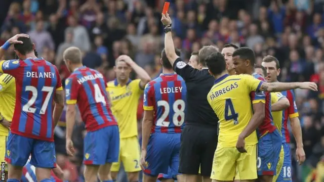 Damien Delaney is shown a red card