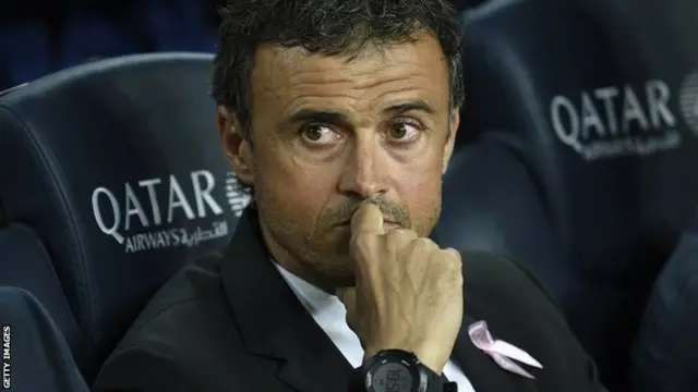 Luis Enrique looks on