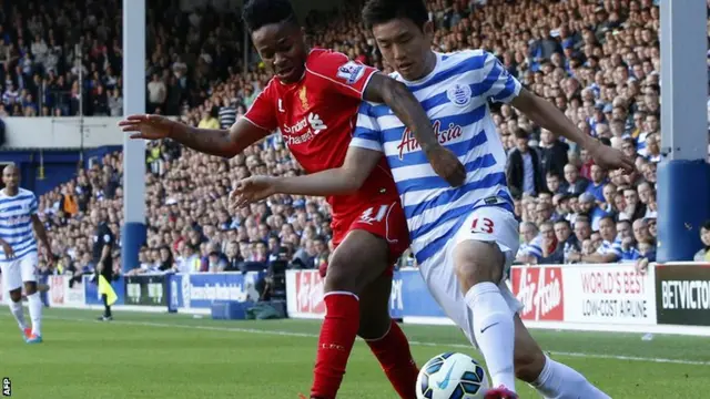 Raheem Sterling battles with Yun Suk-young for the ball