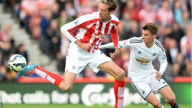 Peter Crouch controls the ball