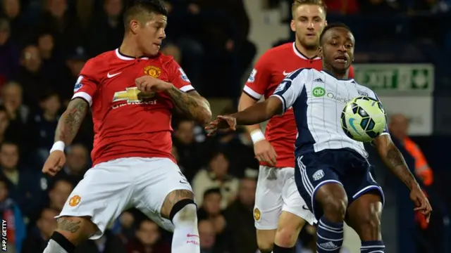 Luke Shaw and Marcos Rojo vie for the ball with West Brom's Saido Berahino