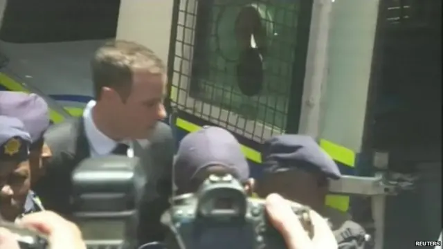 Pistorius boards a police van after being sentenced